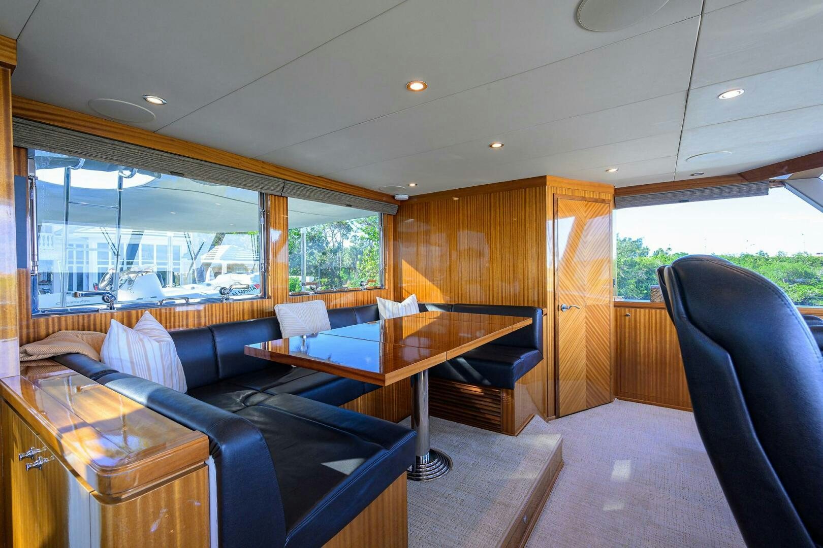 a living room with a couch and a table aboard JANE E Yacht for Sale