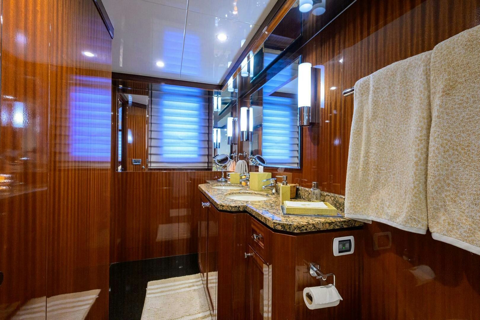a bathroom with a countertop sink and cabinets aboard JANE E Yacht for Sale