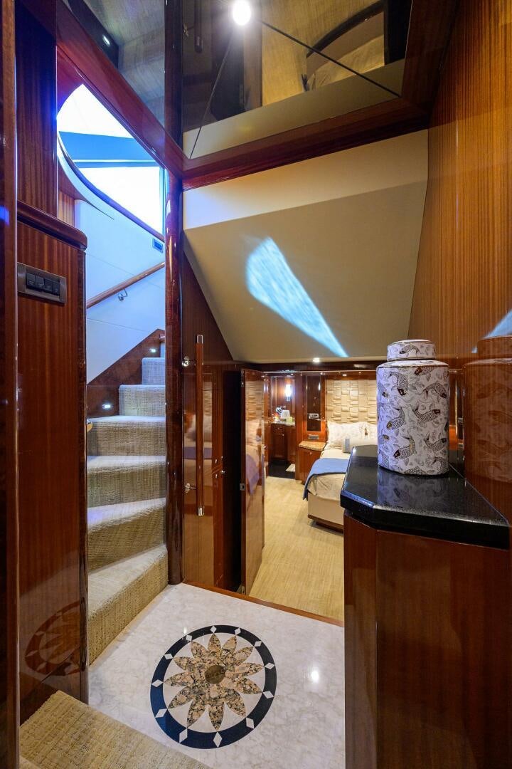 a room with a statue and a rug aboard JANE E Yacht for Sale