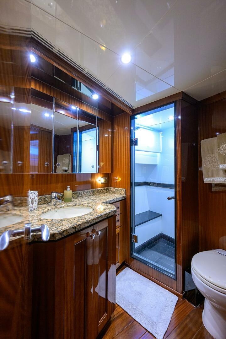 a bathroom with a sink and a mirror aboard JANE E Yacht for Sale