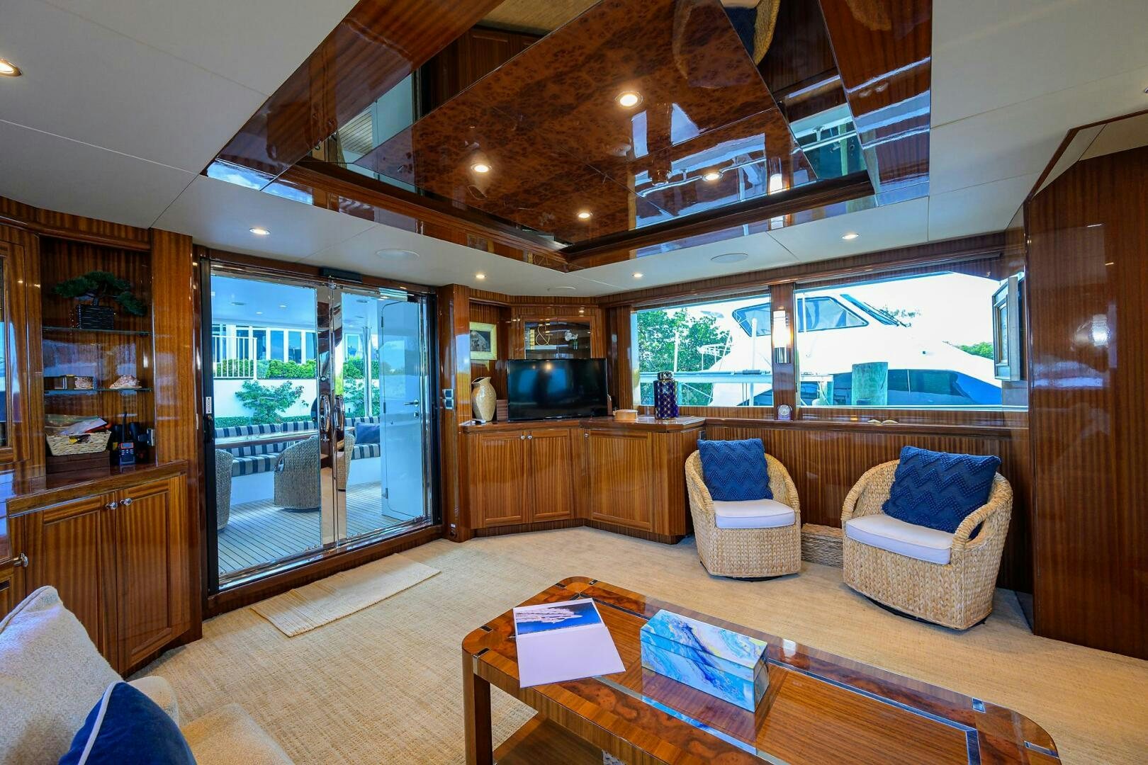 a living room with a wood floor aboard JANE E Yacht for Sale