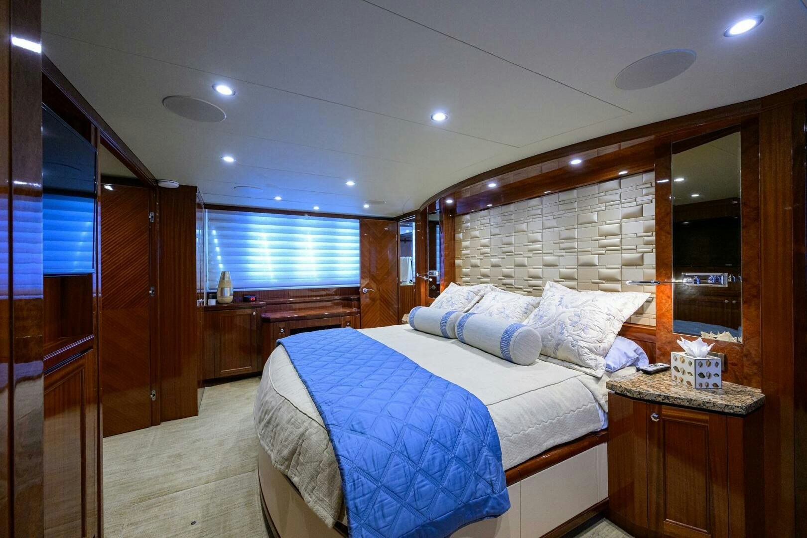 a bedroom with a bed and a closet aboard JANE E Yacht for Sale
