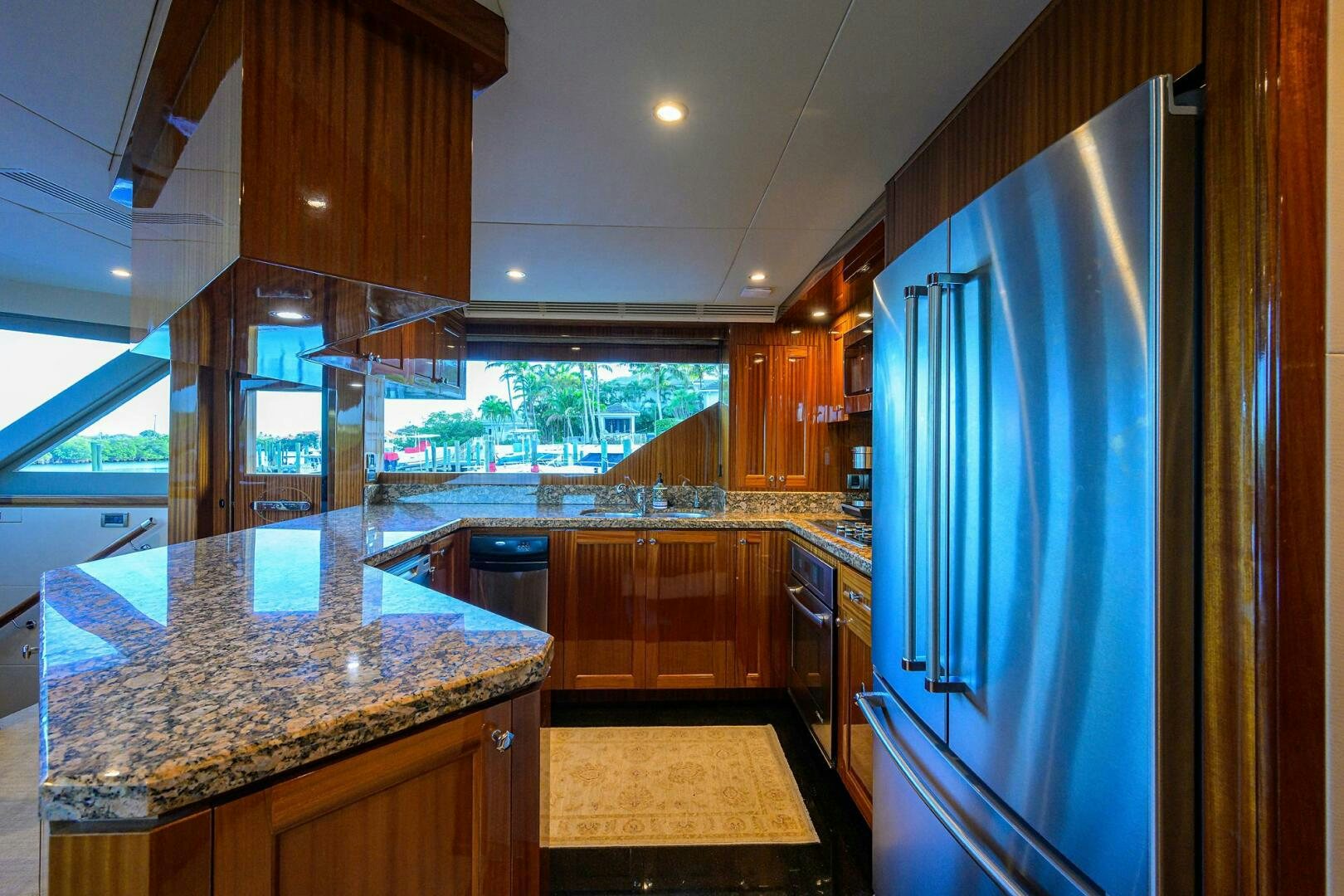 a kitchen with a large island aboard JANE E Yacht for Sale