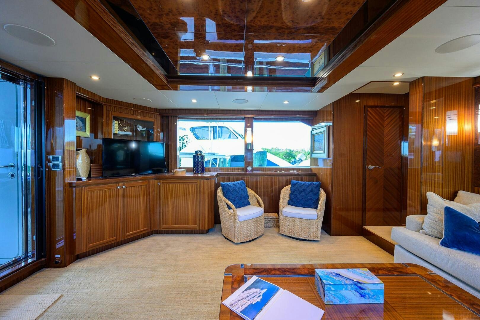 a living room with a wood ceiling aboard JANE E Yacht for Sale