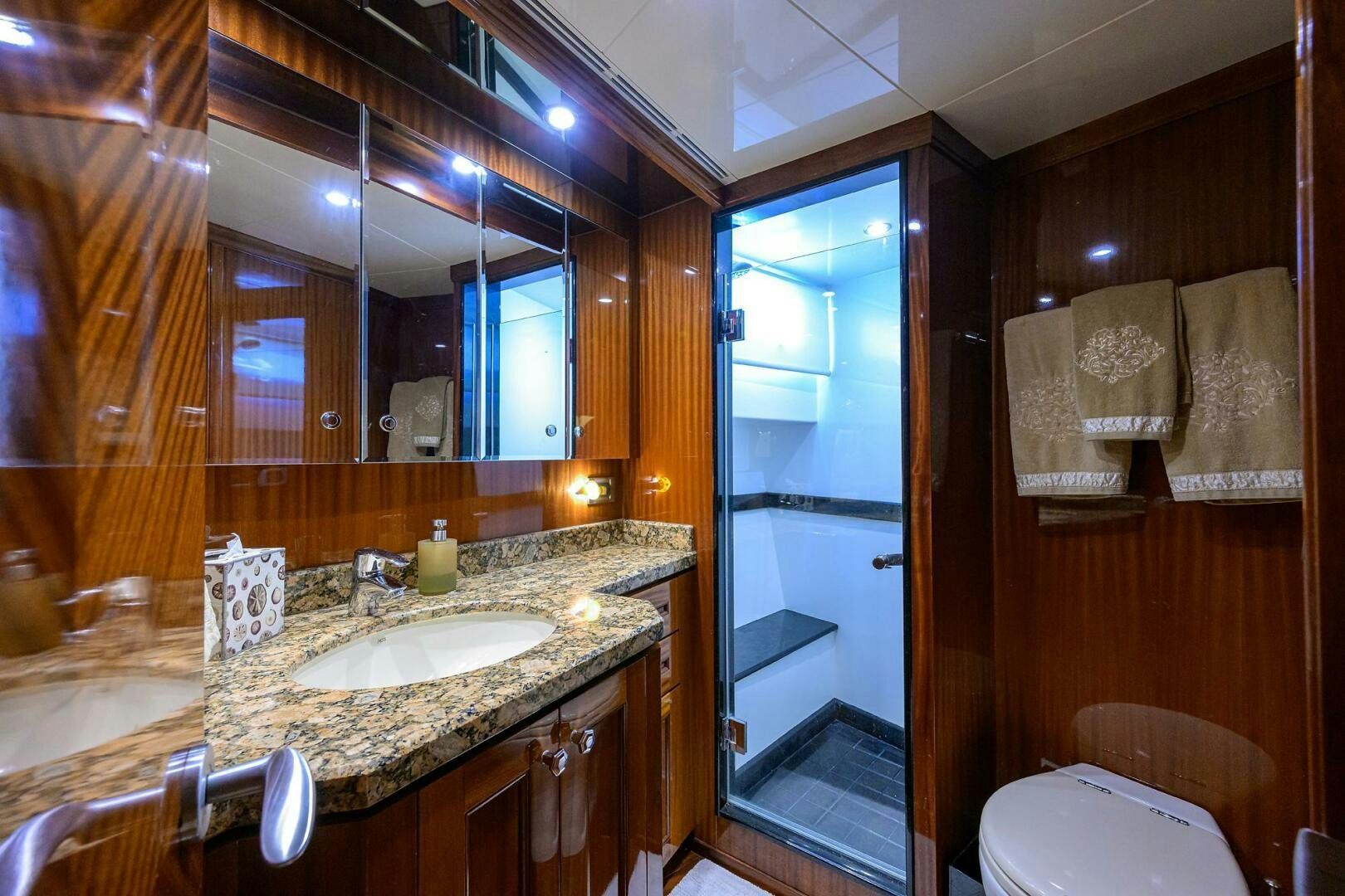 a bathroom with a large mirror aboard JANE E Yacht for Sale