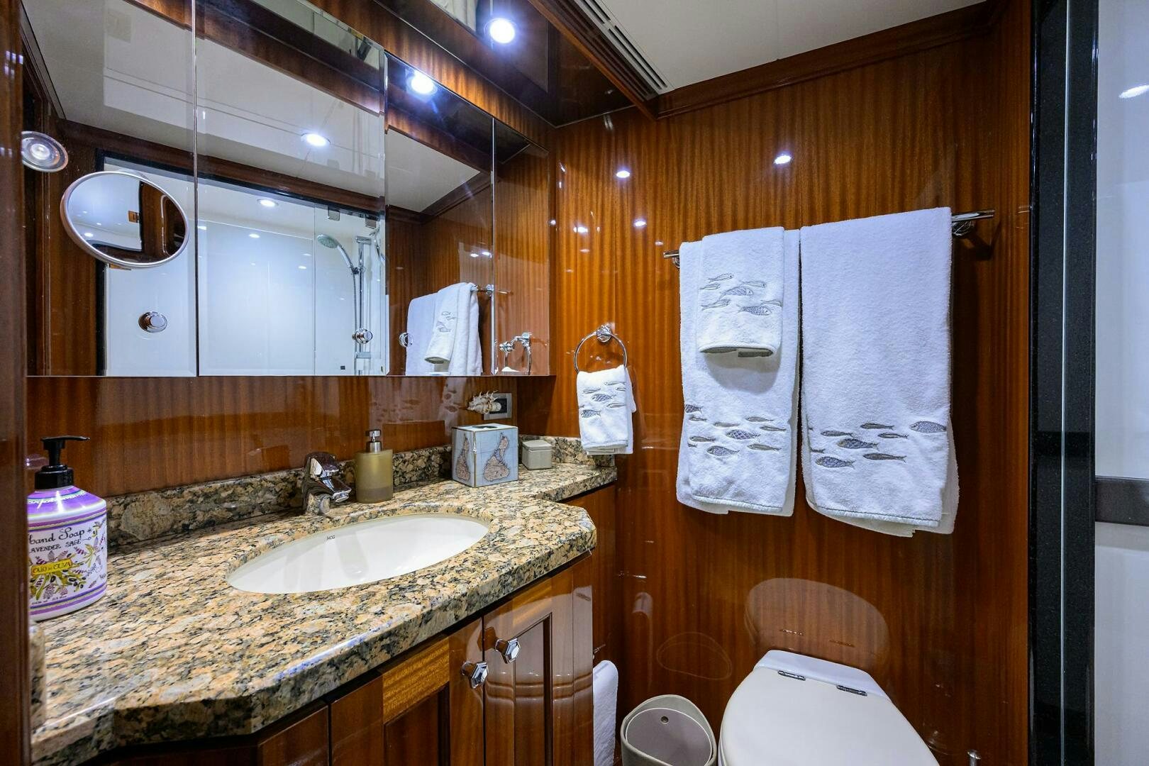 a bathroom with a sink and a mirror aboard JANE E Yacht for Sale