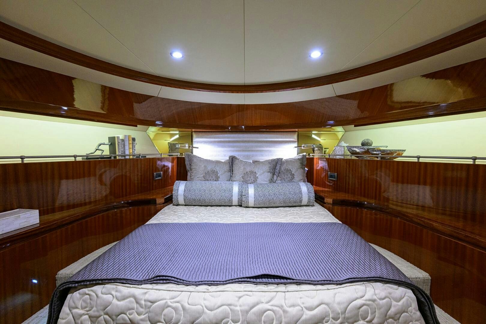 a bed with a purple sheet aboard JANE E Yacht for Sale