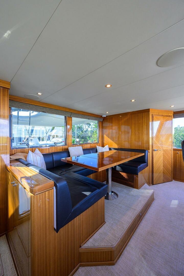 a room with a couch and a table aboard JANE E Yacht for Sale