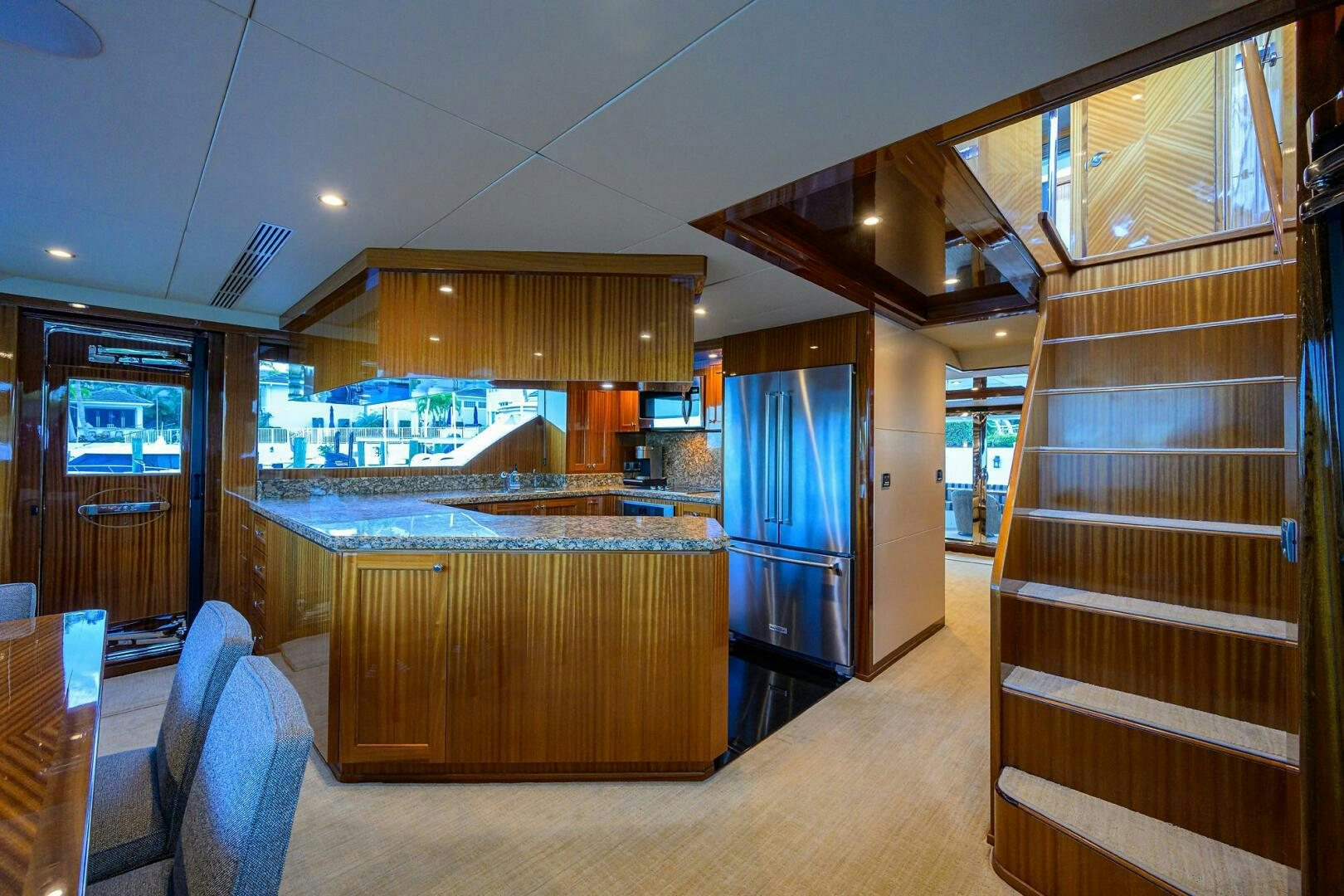 a kitchen with a glass door aboard JANE E Yacht for Sale