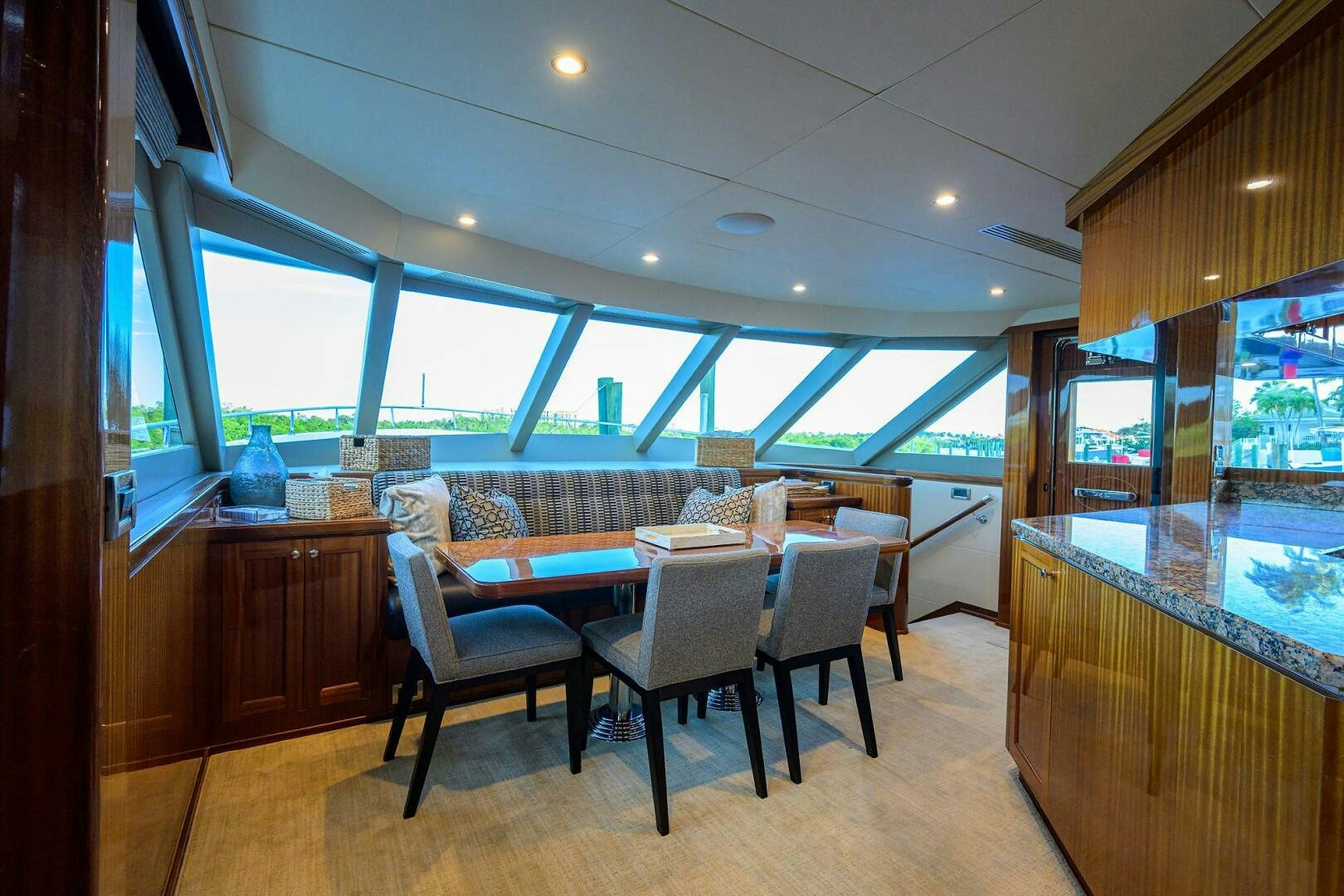 a kitchen and dining area aboard JANE E Yacht for Sale