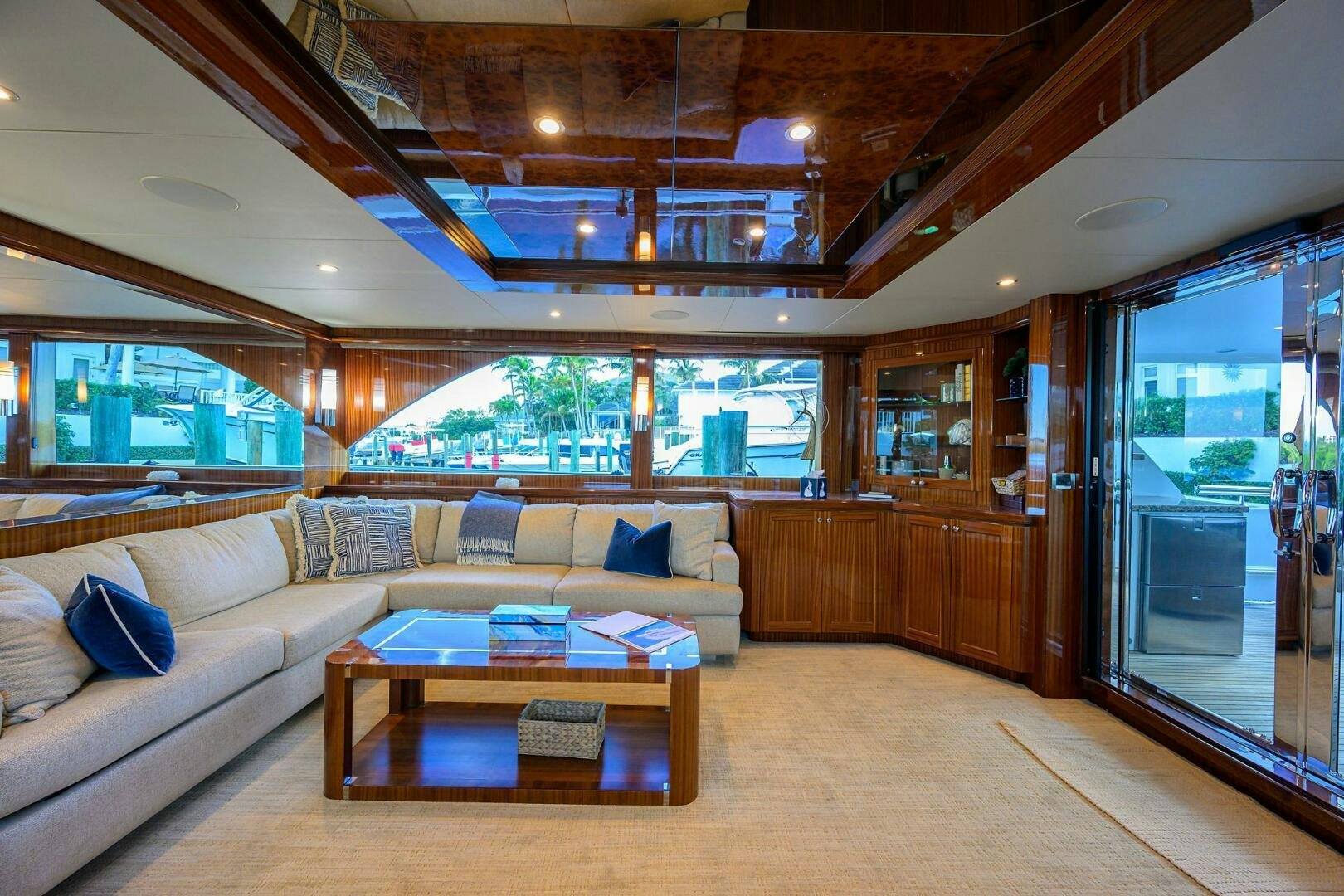 a living room with a large window aboard JANE E Yacht for Sale