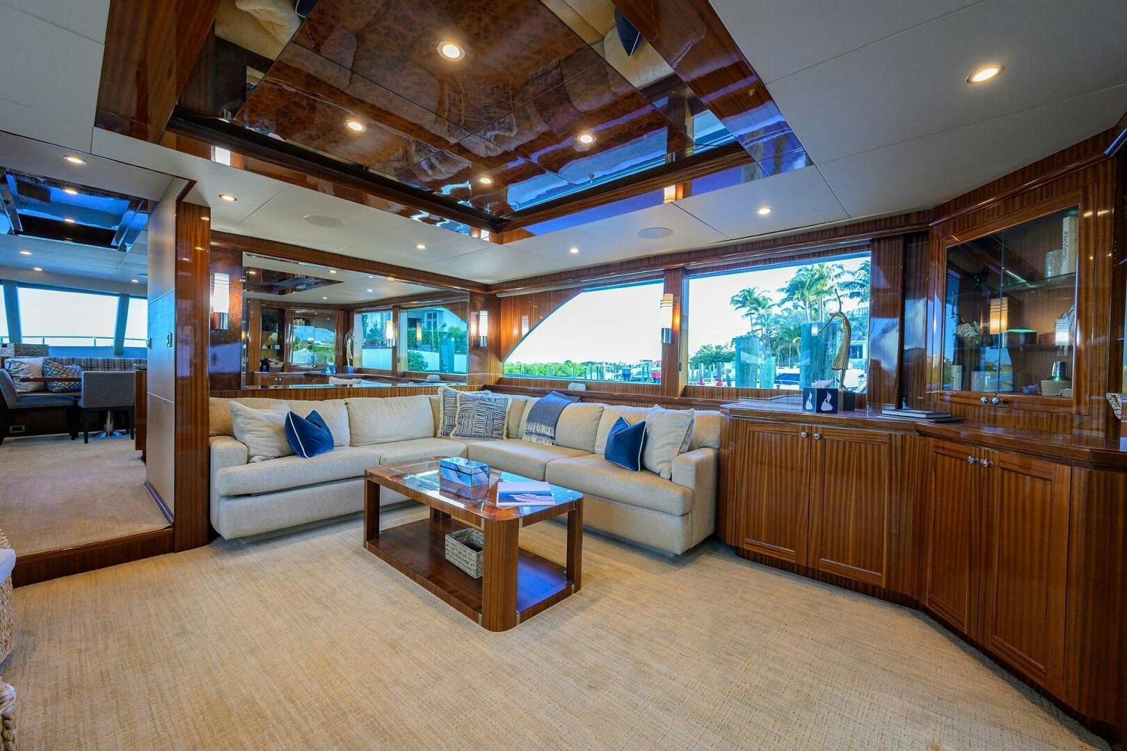 a living room with a couch and a table aboard JANE E Yacht for Sale