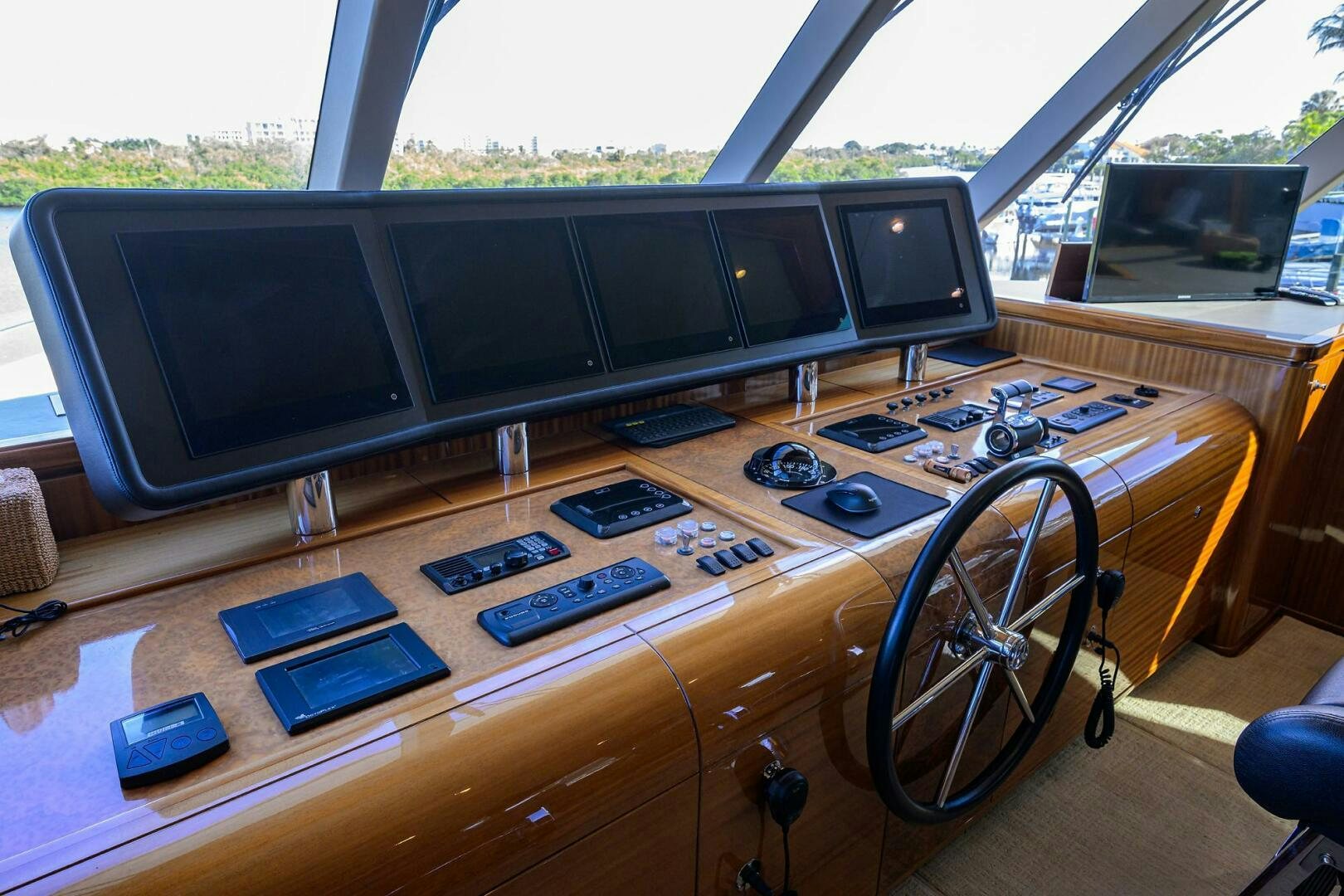 a desk with a computer and a laptop on it aboard JANE E Yacht for Sale