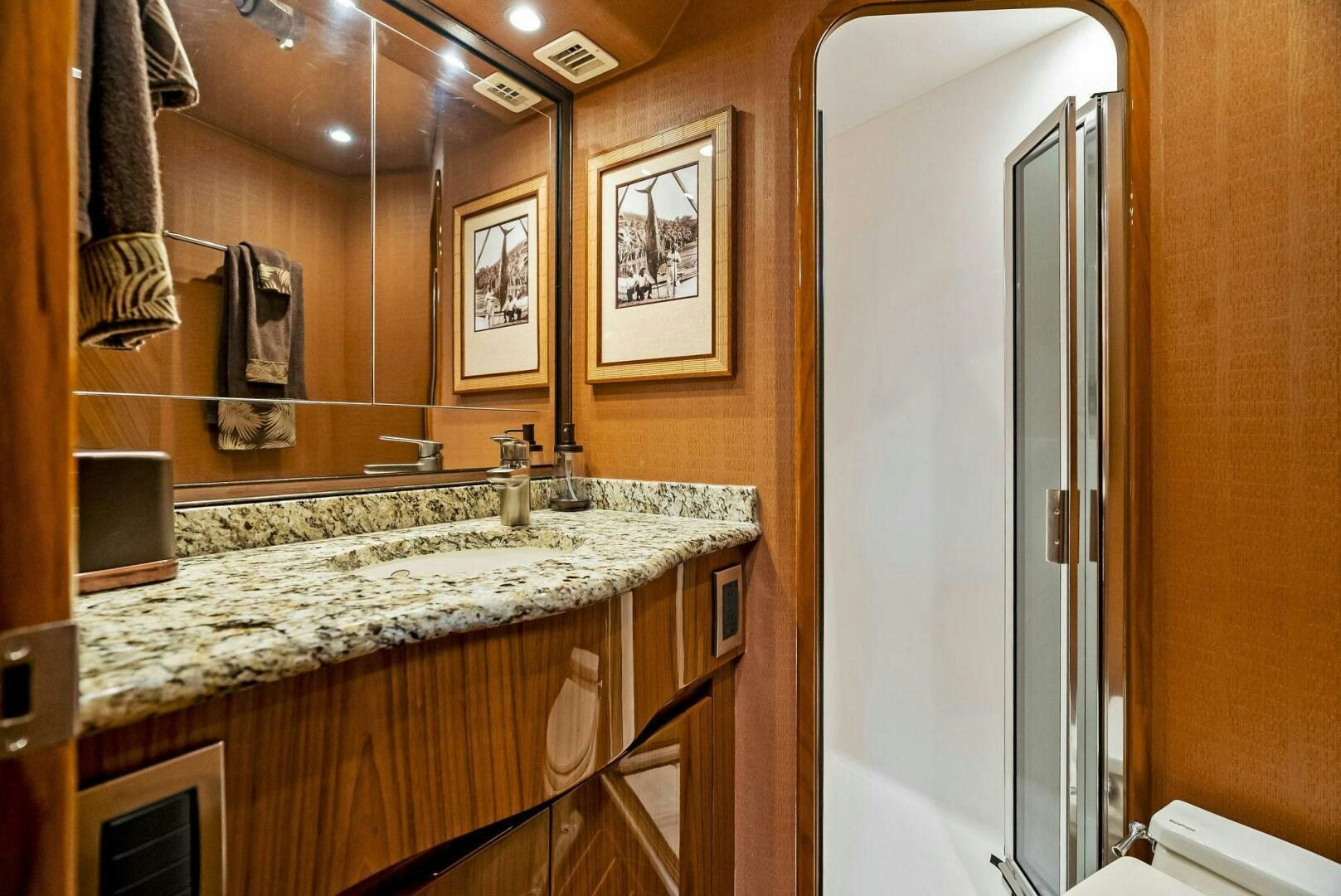 a bathroom with a large mirror aboard FORTY NINER Yacht for Sale