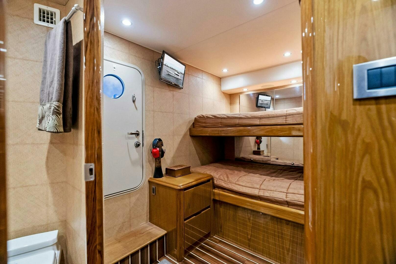 a bedroom with a bed and a desk aboard FORTY NINER Yacht for Sale