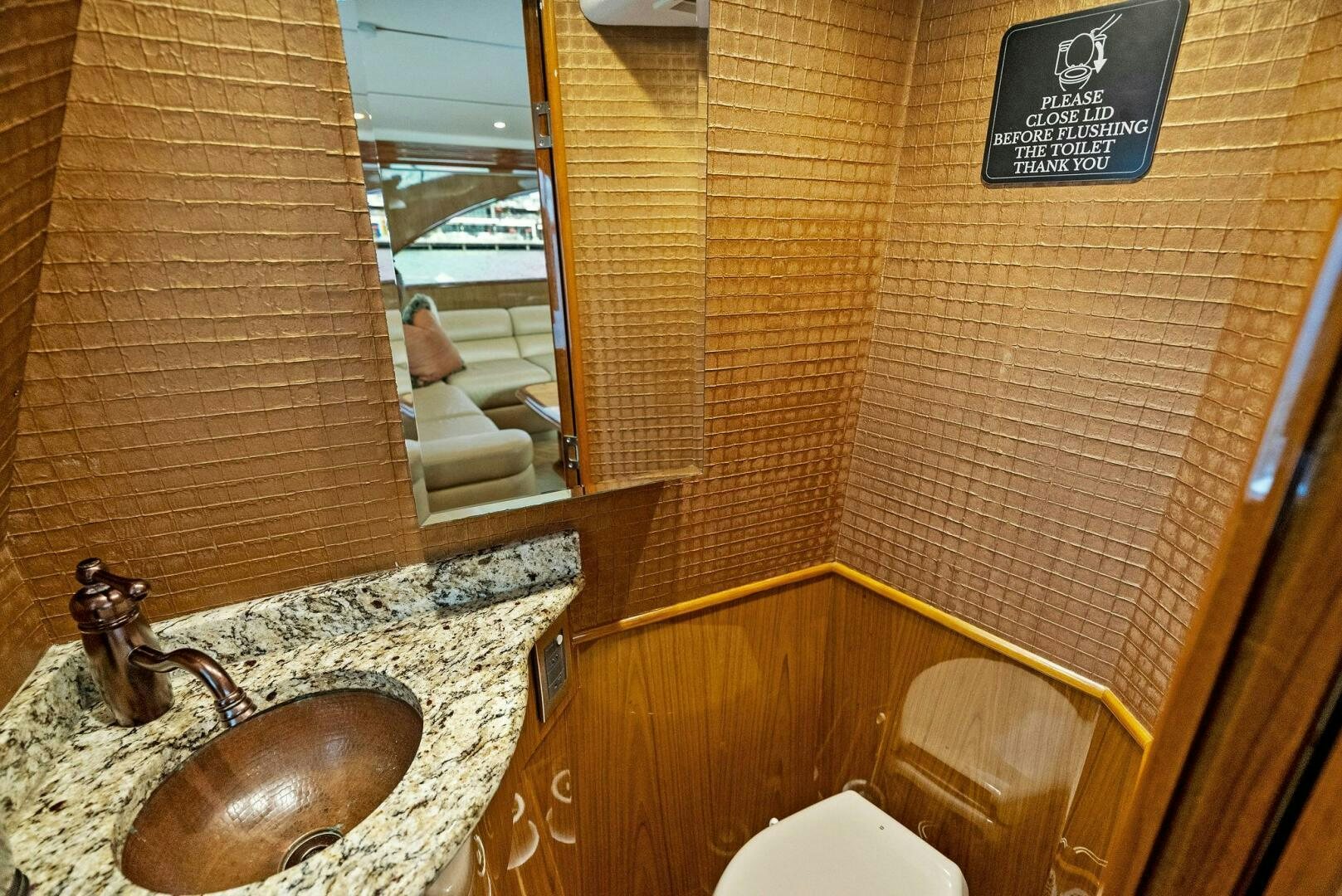 a bathroom with a marble countertop aboard FORTY NINER Yacht for Sale
