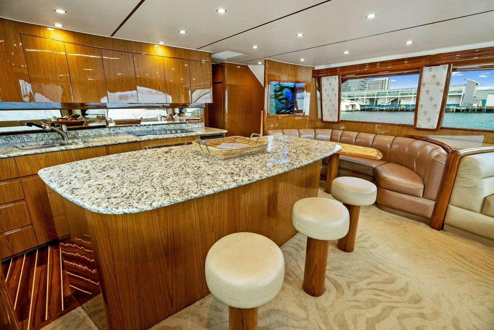 a large kitchen with a bar and bar aboard FORTY NINER Yacht for Sale