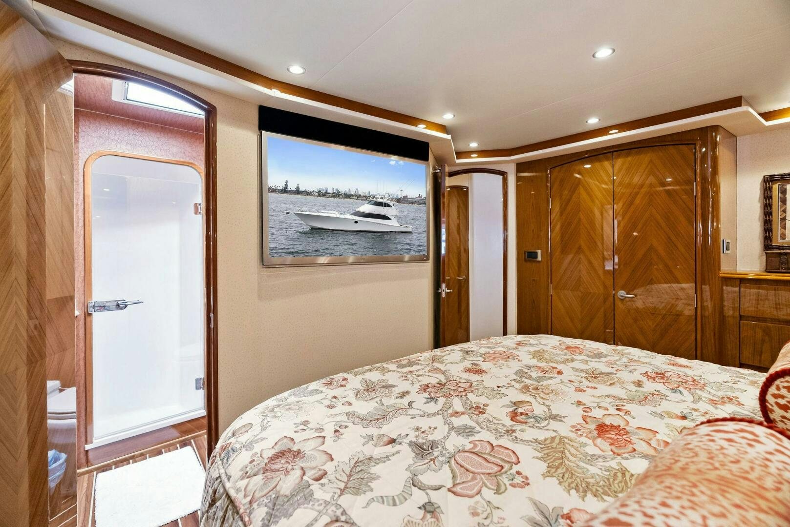 a bedroom with a bed and a television aboard FORTY NINER Yacht for Sale