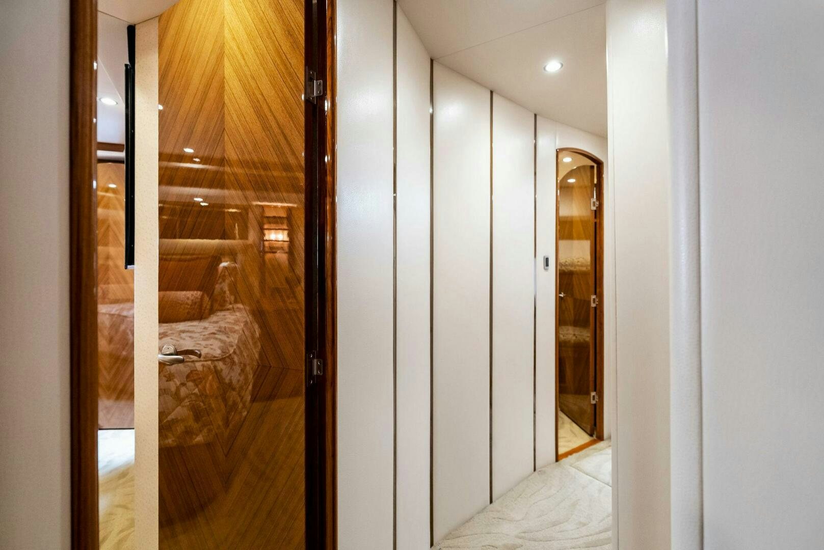 a hallway with glass doors aboard FORTY NINER Yacht for Sale