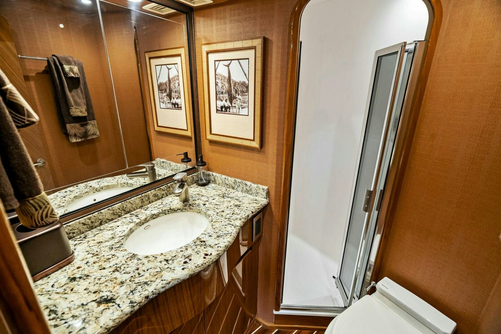 a bathroom with a marble countertop aboard FORTY NINER Yacht for Sale