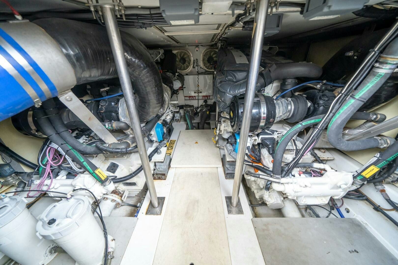 a room with pipes and wires aboard SERENDIPITY II Yacht for Sale