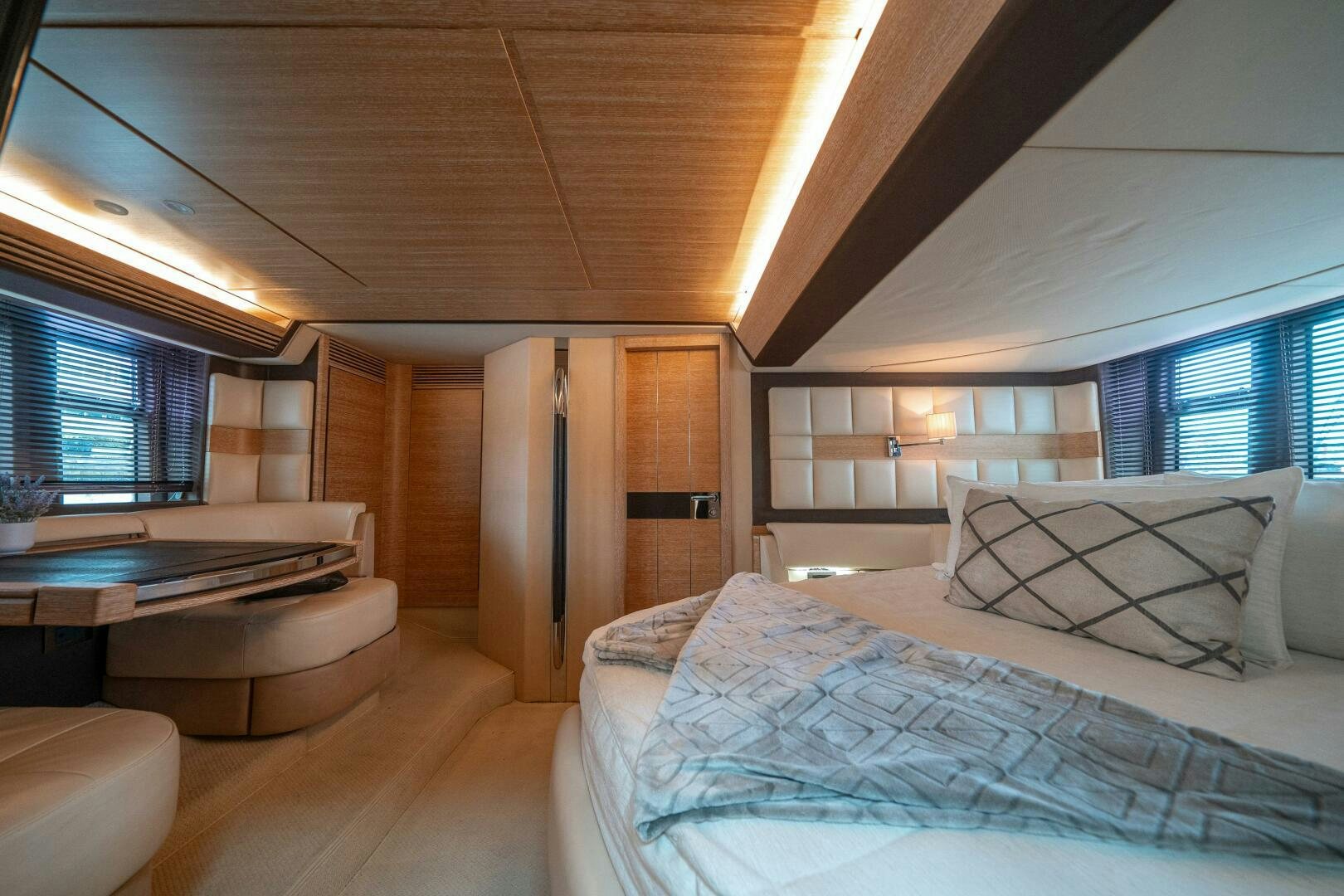 a bedroom with a bed and a couch aboard SERENDIPITY II Yacht for Sale