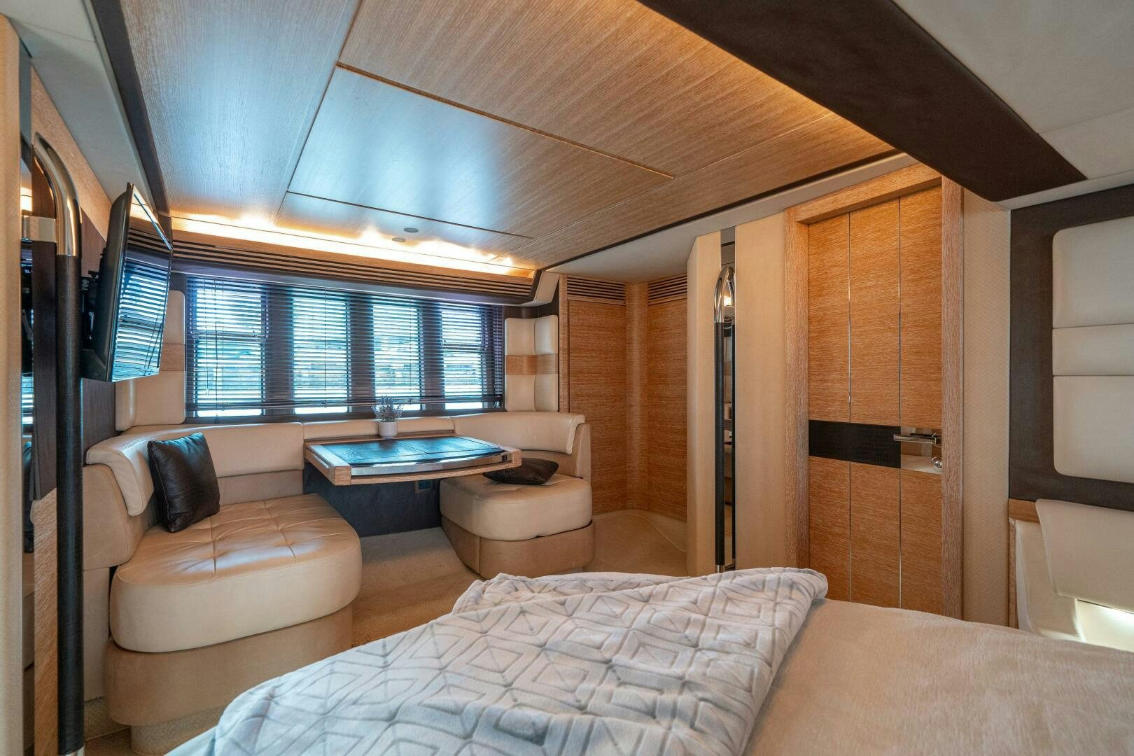a room with a bed and a couch aboard SERENDIPITY II Yacht for Sale