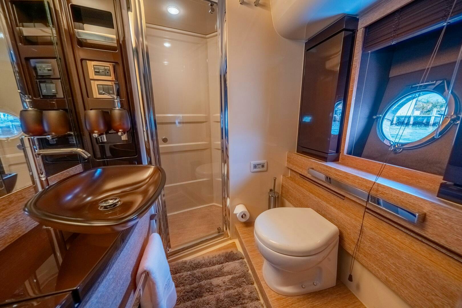 a bathroom with a glass shower aboard SERENDIPITY II Yacht for Sale