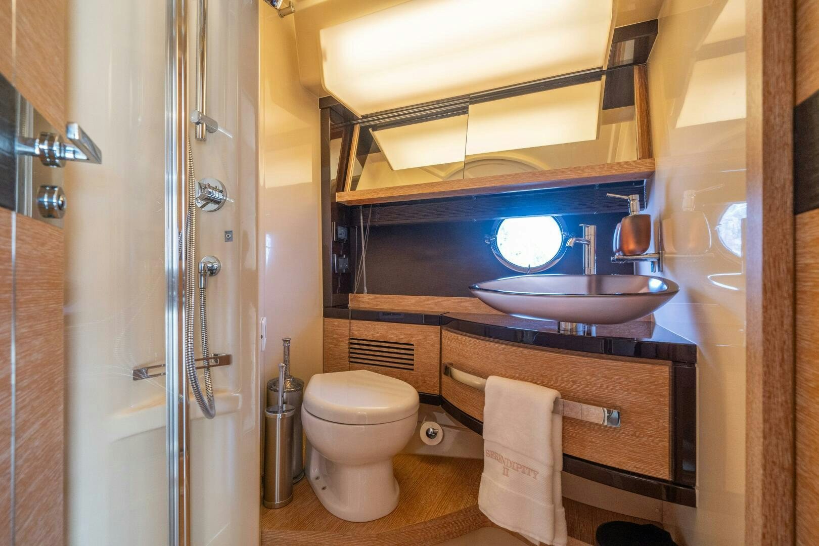 a bathroom with a sink and toilet aboard SERENDIPITY II Yacht for Sale