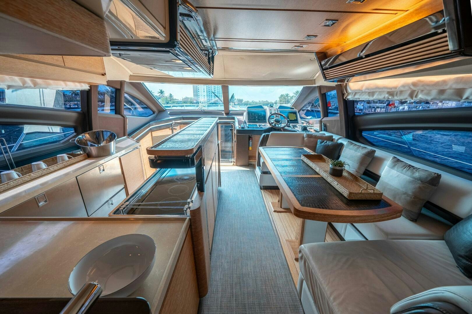 inside of a building with a large window and a table with chairs aboard SERENDIPITY II Yacht for Sale