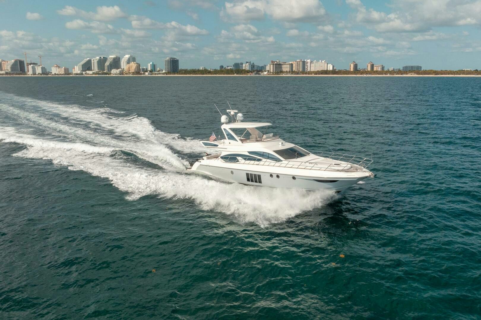 a white boat on the water aboard SERENDIPITY II Yacht for Sale