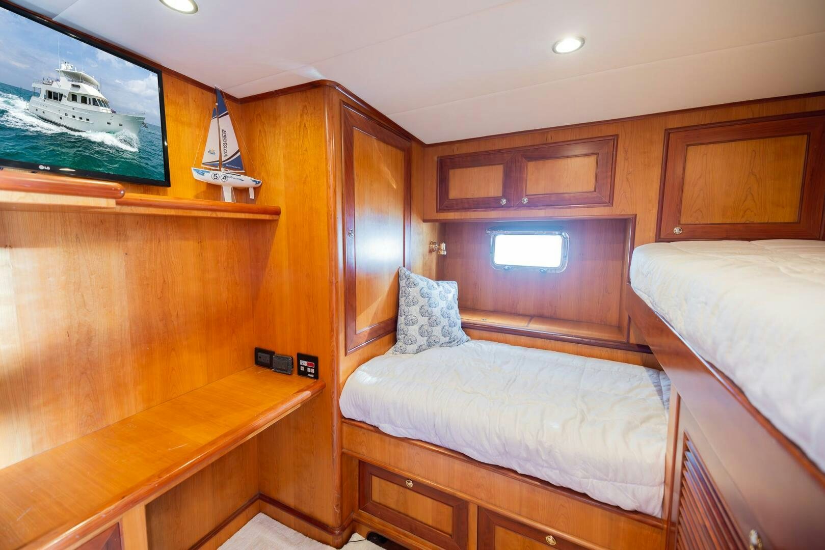 a room with a bed and a desk aboard COLETTE Yacht for Sale