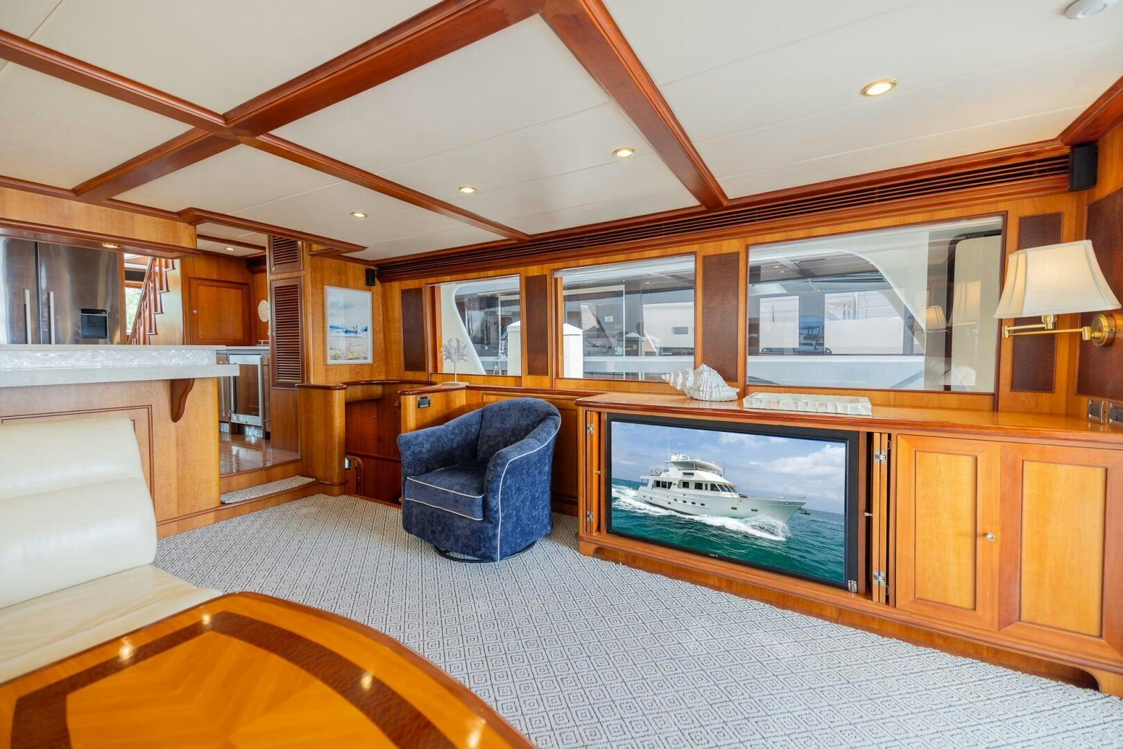 a living room with a large television aboard COLETTE Yacht for Sale