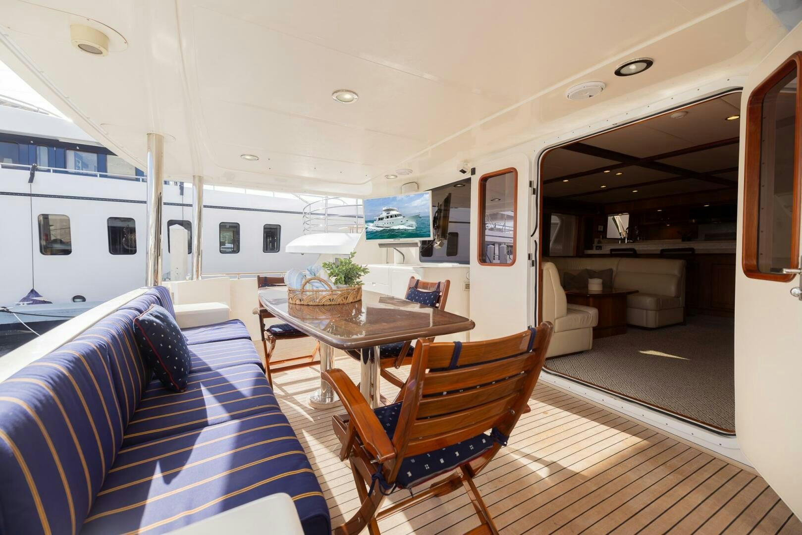 a room with a table and chairs aboard COLETTE Yacht for Sale