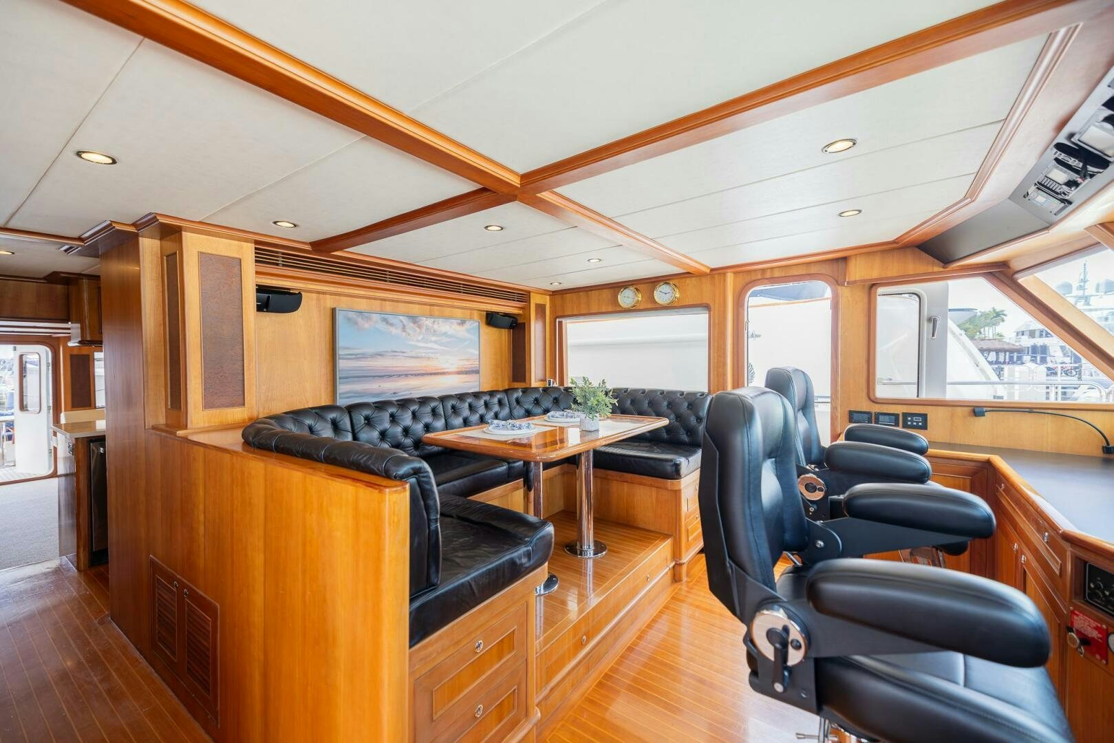 a living room with a piano aboard COLETTE Yacht for Sale