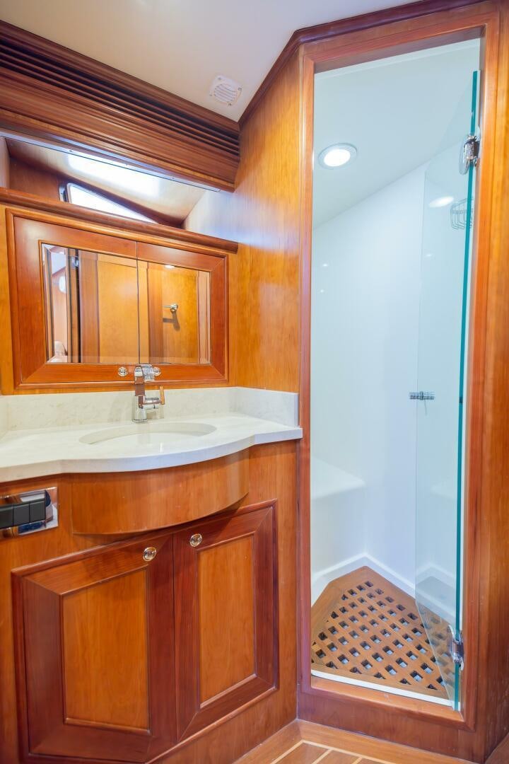 a bathroom with a sink and a mirror aboard COLETTE Yacht for Sale