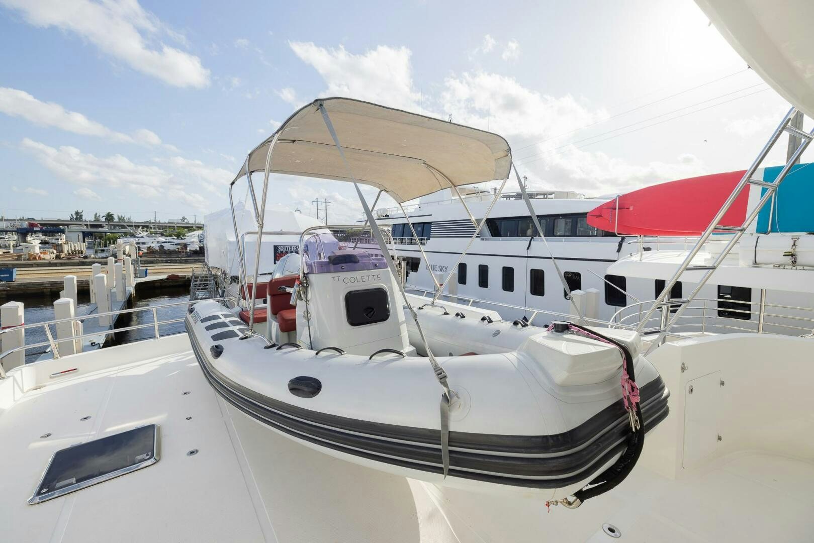 a white boat in a harbor aboard COLETTE Yacht for Sale