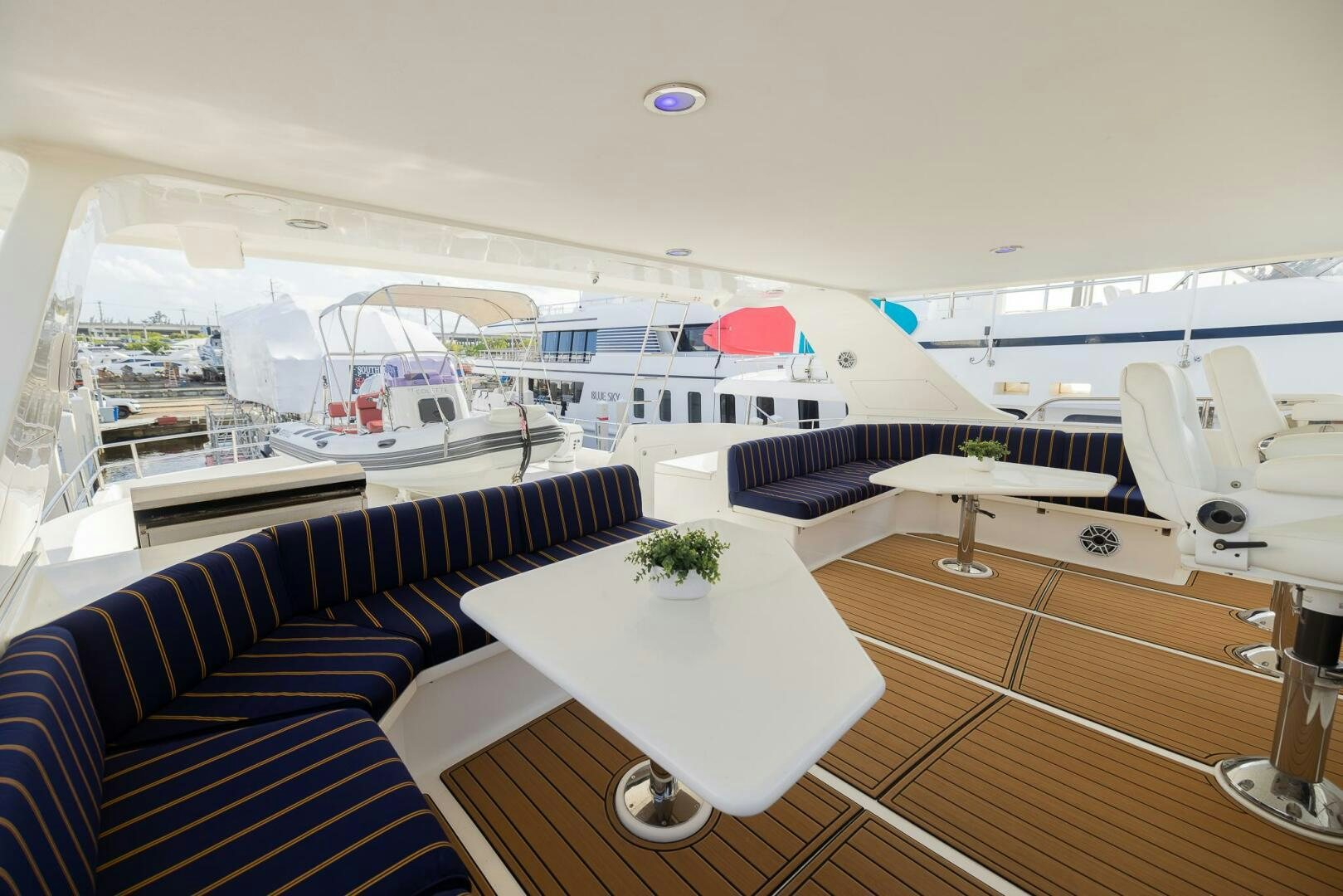 a room with a table and chairs aboard COLETTE Yacht for Sale