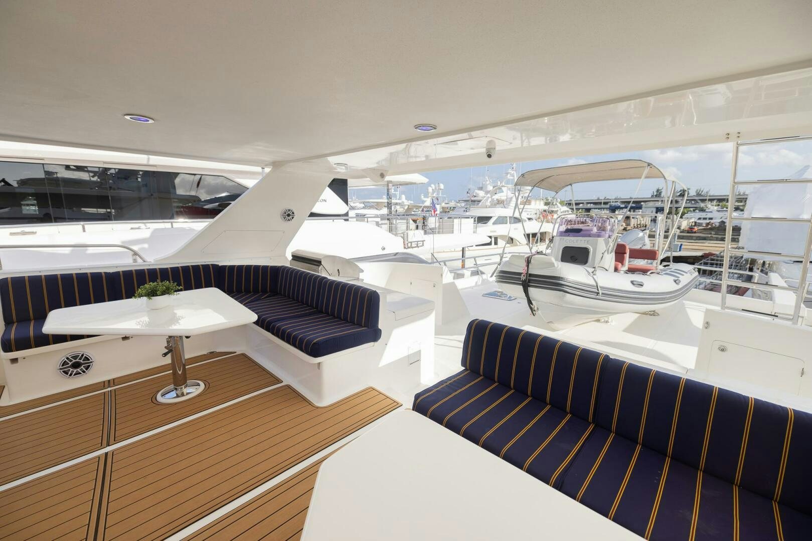 a room with a table and chairs aboard COLETTE Yacht for Sale