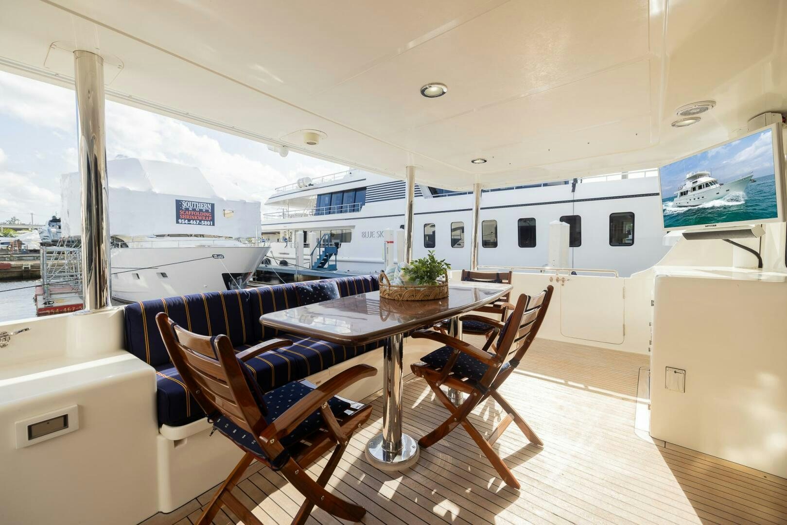 a room with a table and chairs aboard COLETTE Yacht for Sale