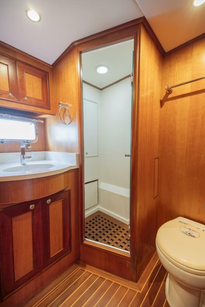a bathroom with a sink and a toilet aboard COLETTE Yacht for Sale