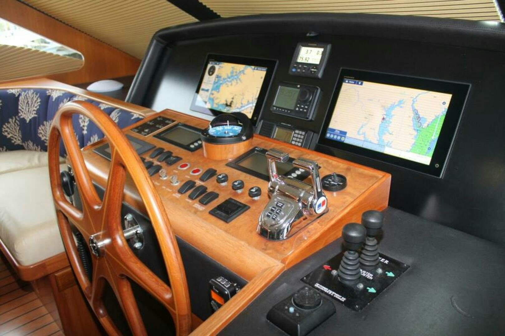 a wooden desk with a machine and a television aboard PARTNERSHIP Yacht for Sale