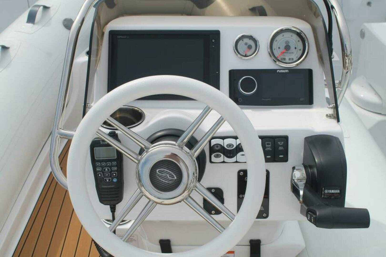 a white car with a steering wheel aboard PARTNERSHIP Yacht for Sale