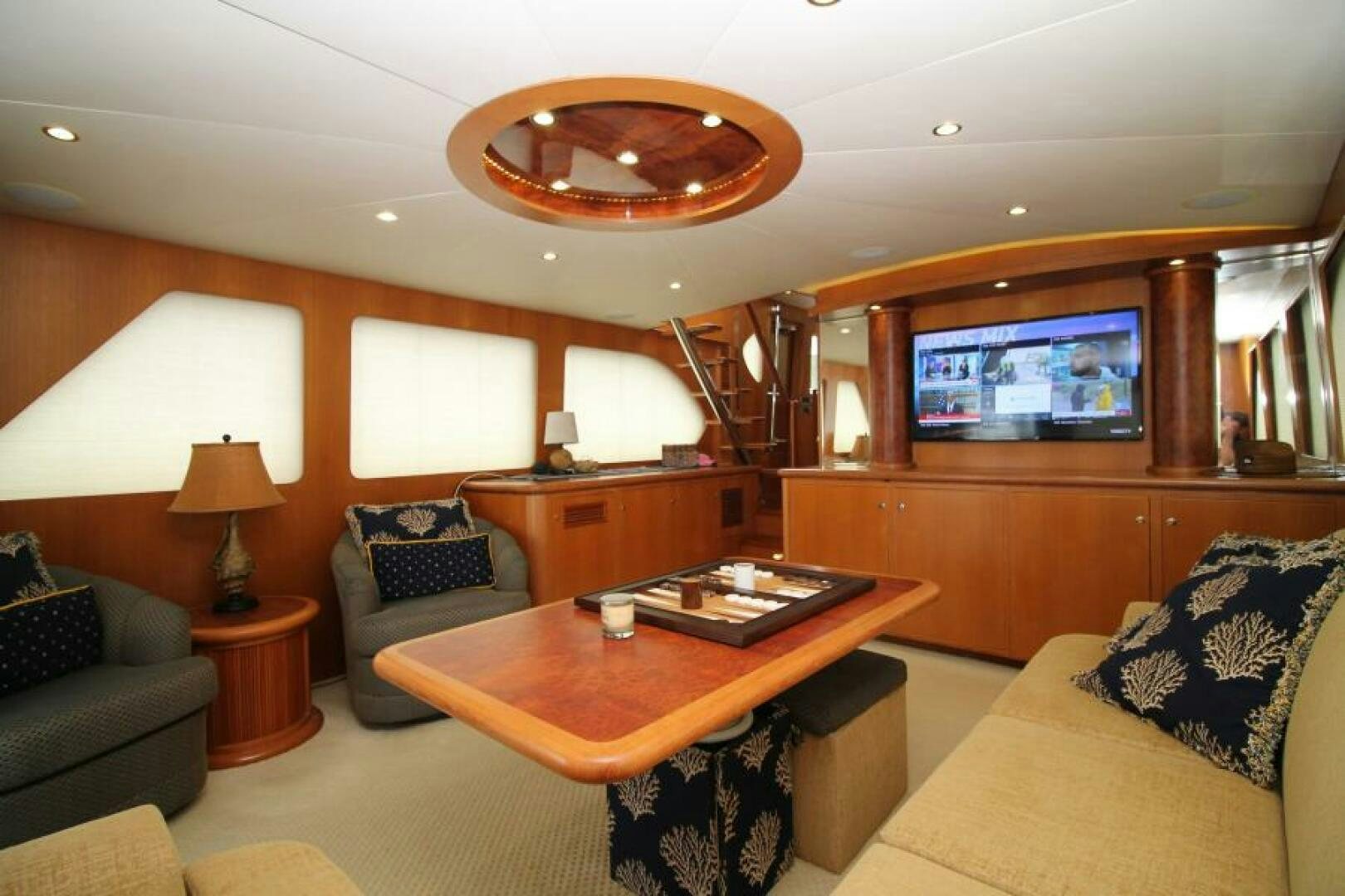 a living room with a couch and a television aboard PARTNERSHIP Yacht for Sale