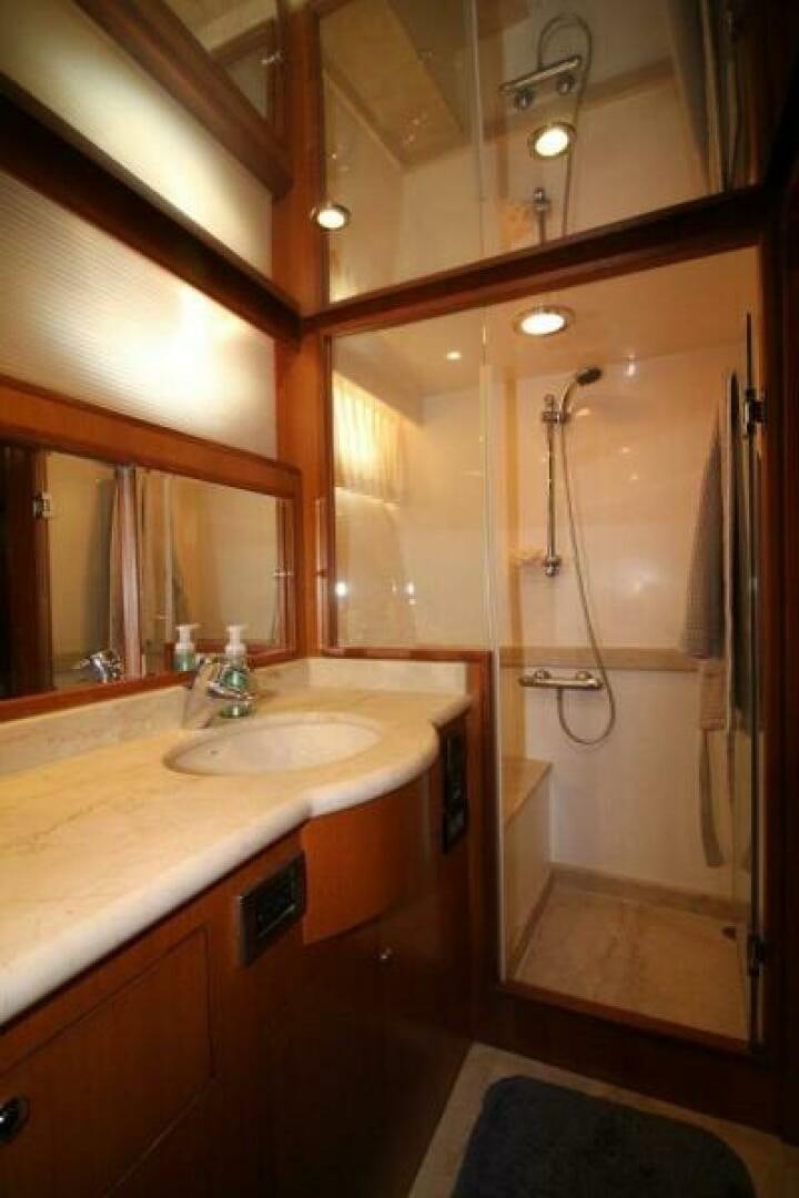 a bathroom with a shower and sink aboard PARTNERSHIP Yacht for Sale