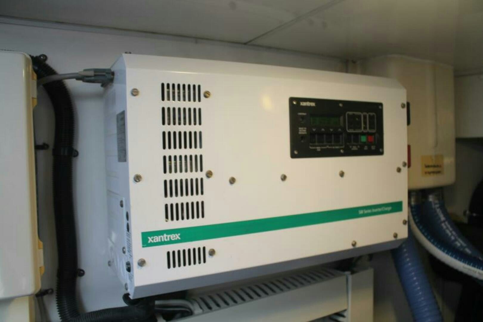 a white machine with a green and black label aboard PARTNERSHIP Yacht for Sale