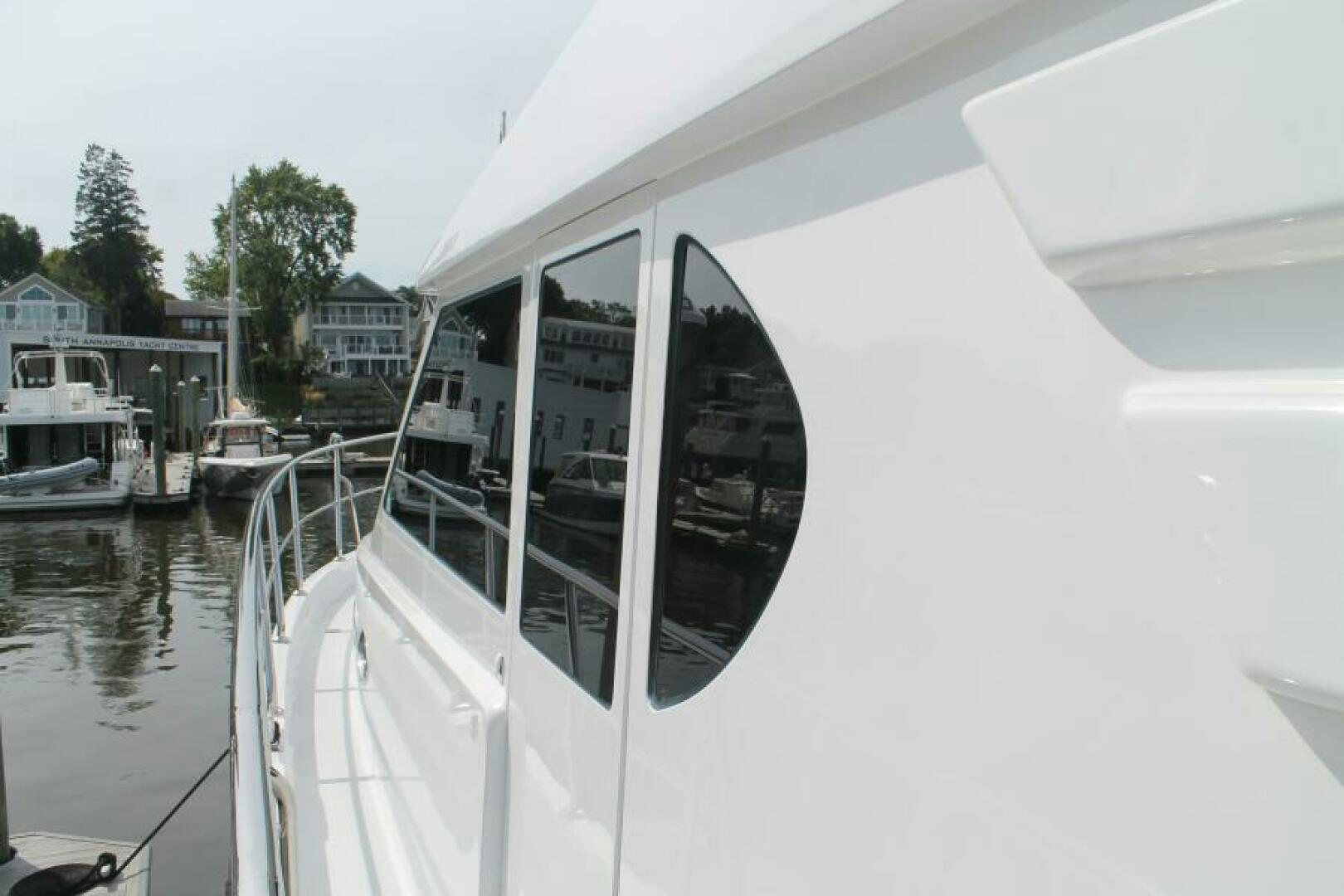 a white boat in a body of water aboard PARTNERSHIP Yacht for Sale