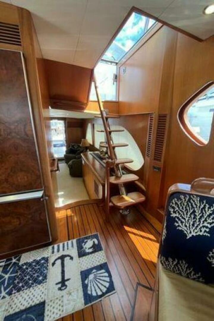 a ladder on a wooden floor aboard PARTNERSHIP Yacht for Sale