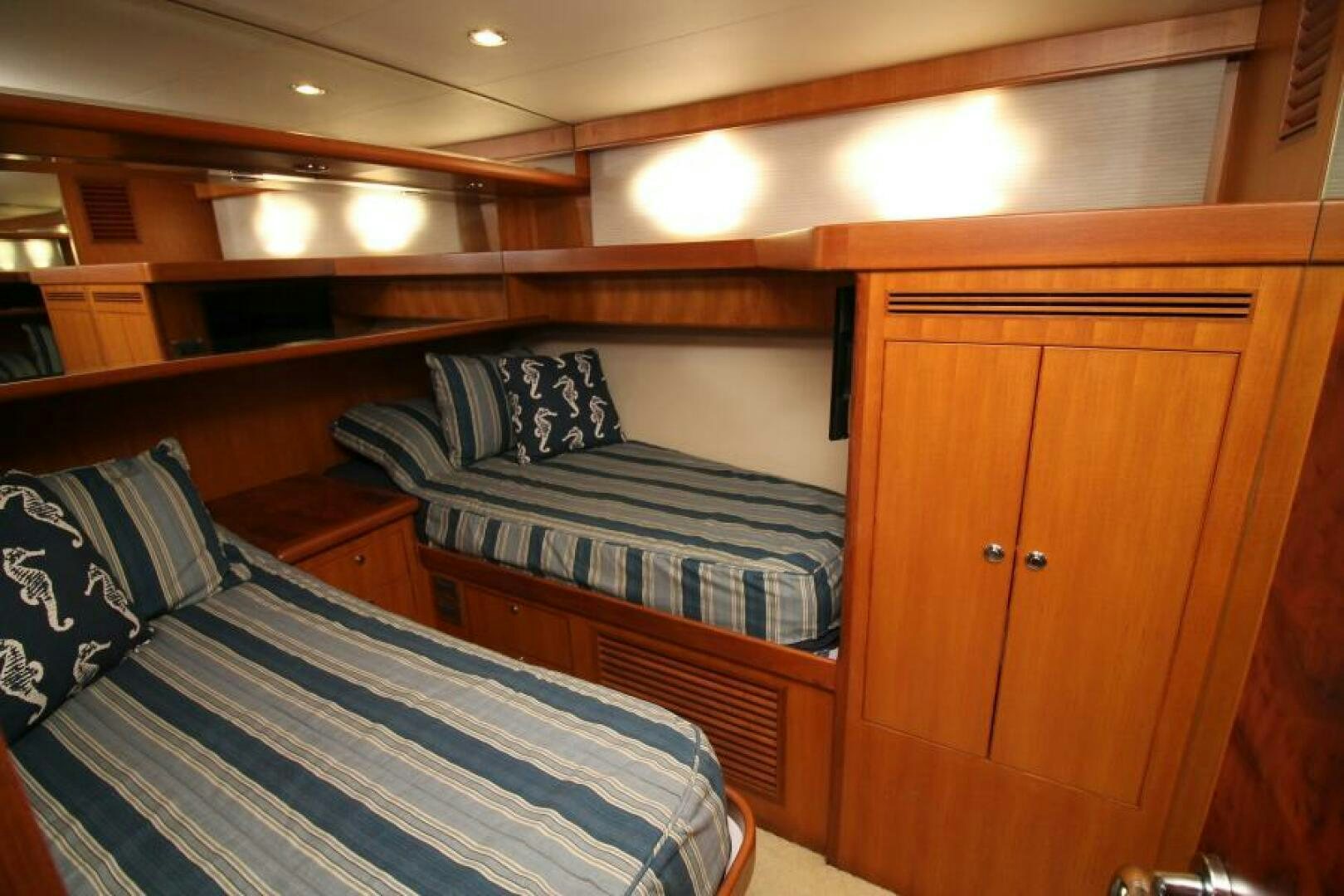 a couple of beds in a room aboard PARTNERSHIP Yacht for Sale