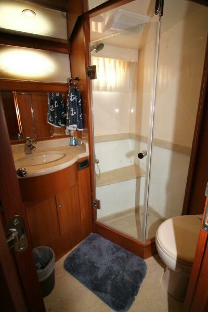 a bathroom with a shower unit and sink aboard PARTNERSHIP Yacht for Sale
